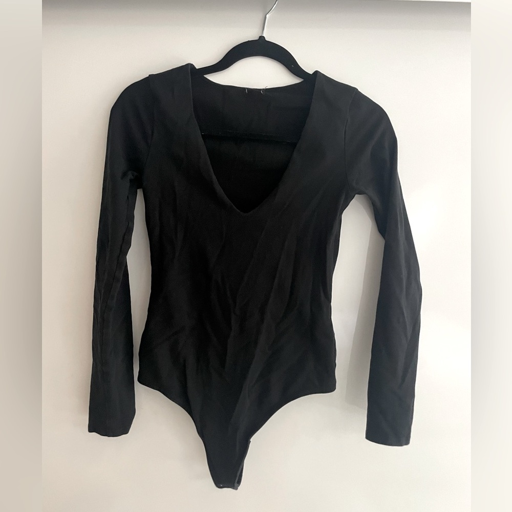 Deep V black body suit with two strong buttons at bottom